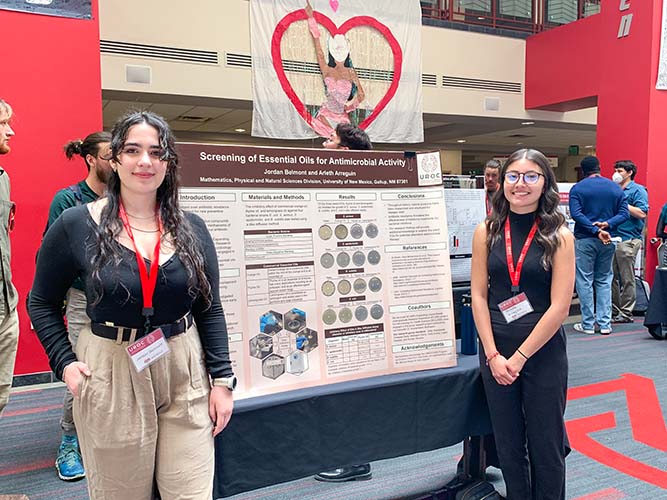 UNM-Gallup students Jordan Belmont, left, and Arleth Arreguin present their poster during the Undergraduate Research Opportunity Conference at The University of New Mexico main campus in Albuquerque on April 12, 2024. 