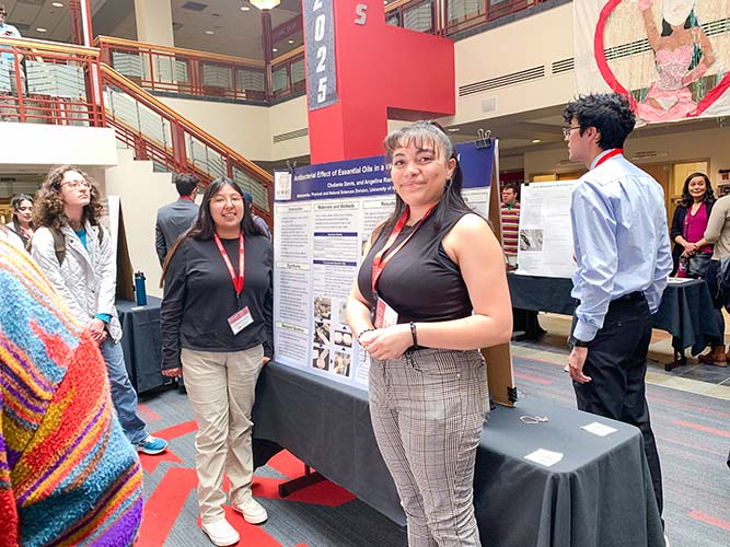 UNM-Gallup students Chalanie Davis, left, and Angelina Romero pose for a photo during the Undergraduate Research Opportunity Conference at The University of New Mexico main campus in Albuquerque on April 12, 2024.