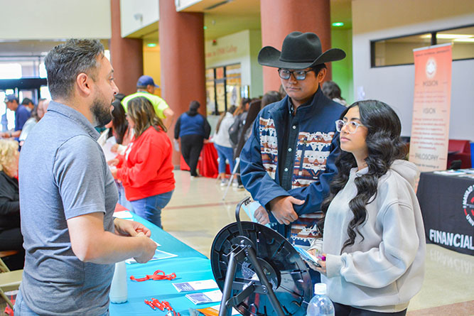 In this Oct. 16, 2024, file photo, students participate in the College Transfer & Scholarship Fair in the Gurley Hall Commons at The University of New Mexico-Gallup.