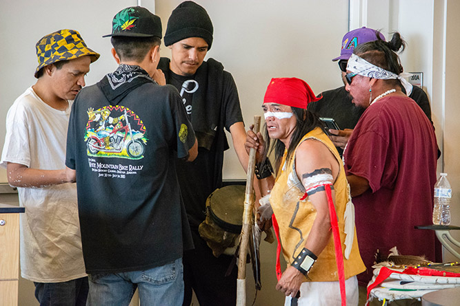 Members of the Che’Be’Tu Apache Sweethearts sing and play the drum during a performance for the New Mexico Consortium of Academic Libraries retreat at The University of New Mexico-Gallup on July 31, 2025.