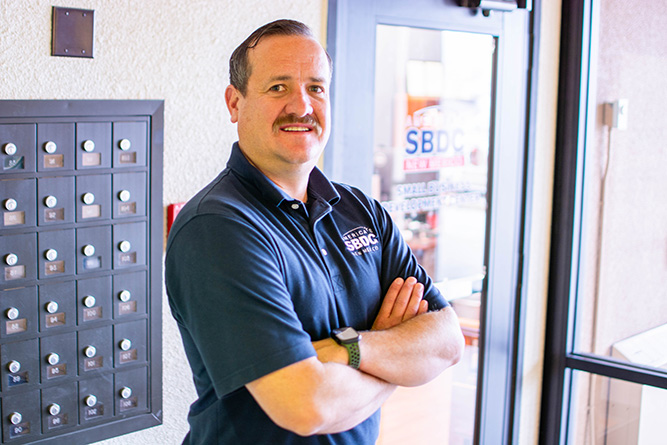 J.M. DeYoung, the new director of the Small Business Development Center at The University of New Mexico-Gallup, poses for a portrait in front of his office inside Gurley Hall on Jan. 23, 2026.