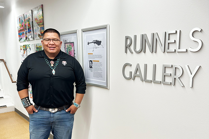 Darrel Watchman poses for a photo at Runnels Gallery at Eastern New Mexico University in Portales, New Mexico, on March 20, 2025.