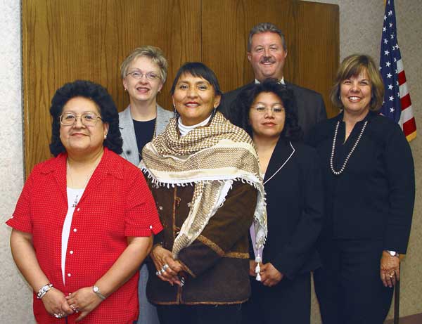 The UNM-G Local Board for 2005 includes two new members: third from left, Gloria Skeet de Cruz, and to her right, June Shack. Returning members are Chair Ruby Wolf, left; Vice Chair Brett Newberry, back, second from right, and Secretary Theresa Dowling, right. Also shown is Dr. Beth Miller, Executive Director.